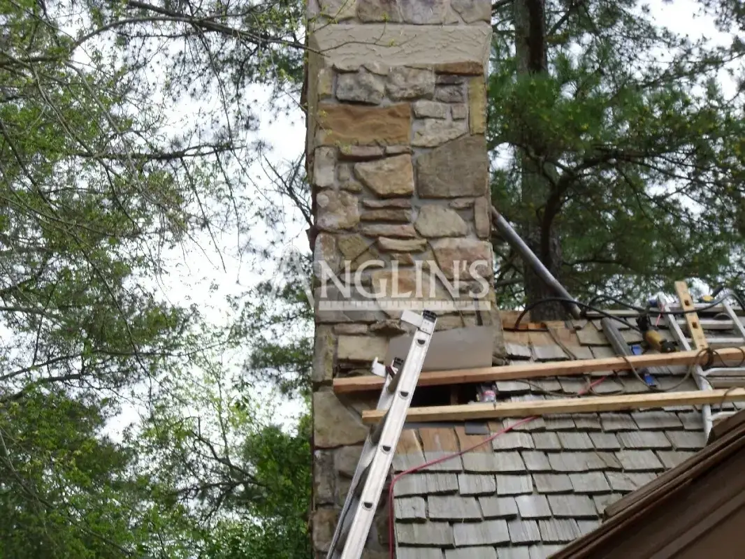 a house with a chimney that is leaning after anglin straighten it